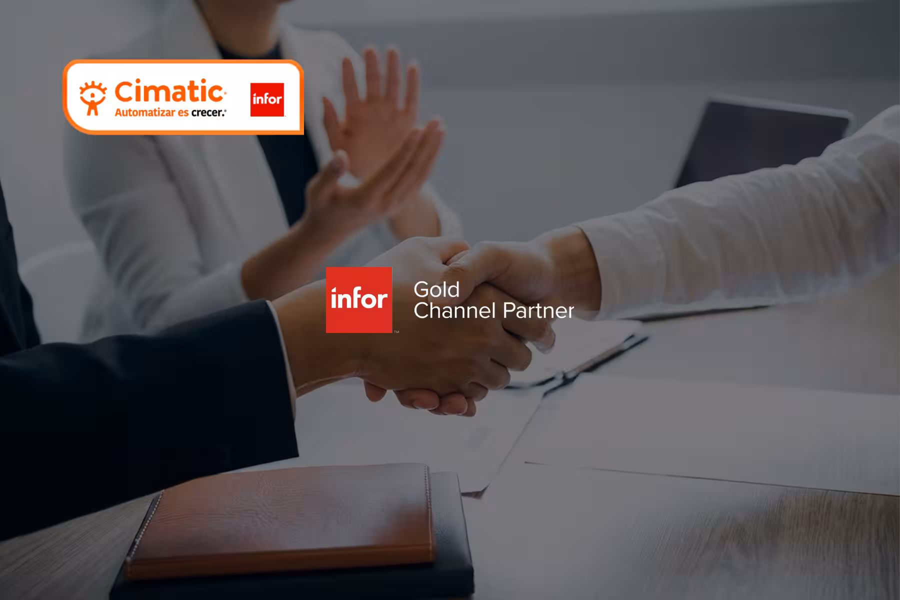 Infor Partner Cimatic. Apretón de manos entre ejecutivos durante una reunión de negocios.